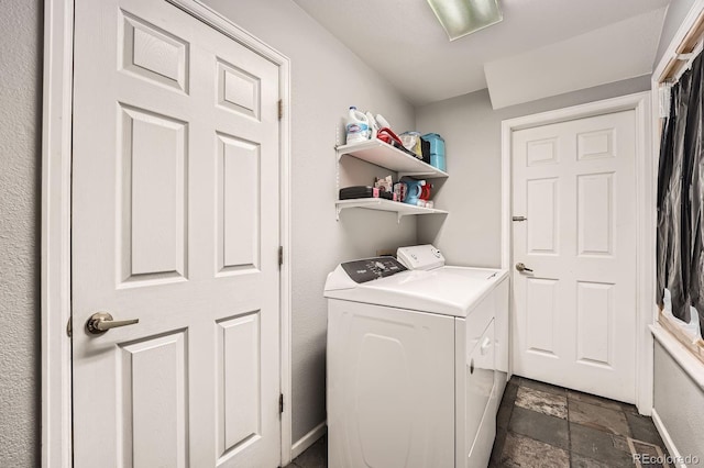 5136 S Ceylon St, Centennial, CO 80015 - washroom featuring independent washer and dryer and dark stone finish flooring