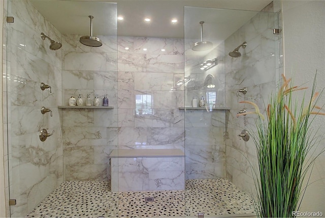 full bathroom with a marble finish shower