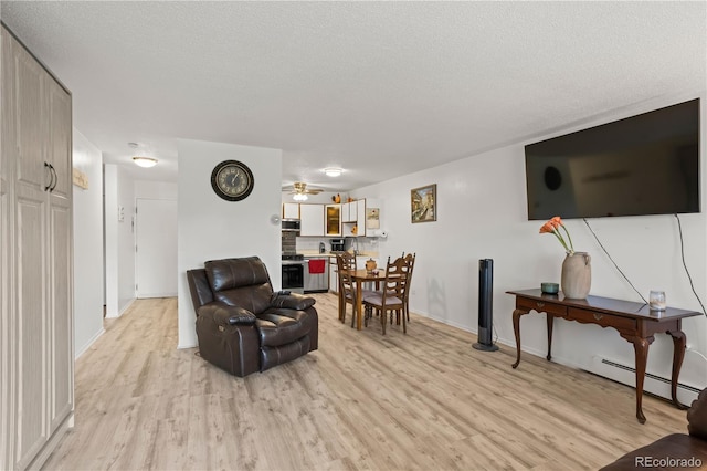 living room featuring a baseboard radiator, light wood-style flooring, a textured ceiling, a ceiling fan, and baseboards