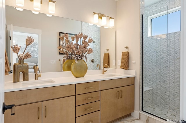 bathroom with vanity and a shower with shower door