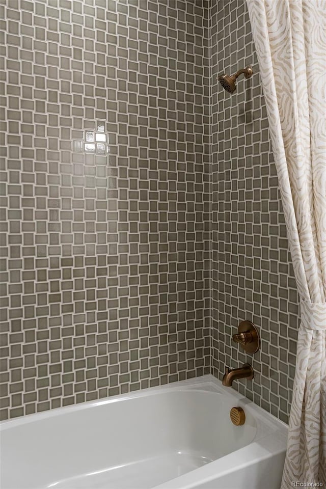 bathroom featuring shower / tub combo with curtain