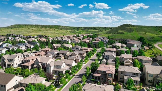 10328 Bluffmont Dr, Lone Tree, CO 80124 - aerial perspective of suburban area featuring a mountain backdrop