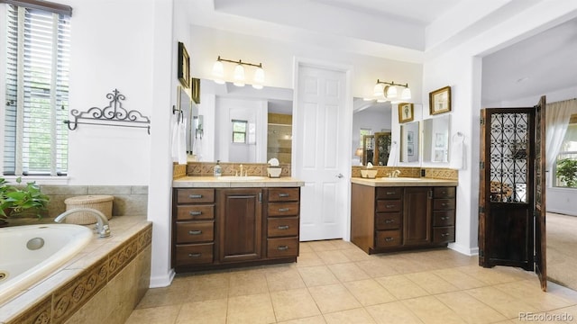 10328 Bluffmont Dr, Lone Tree, CO 80124 - full bathroom featuring tile patterned floors, a stall shower, two vanities, a garden tub, and healthy amount of natural light