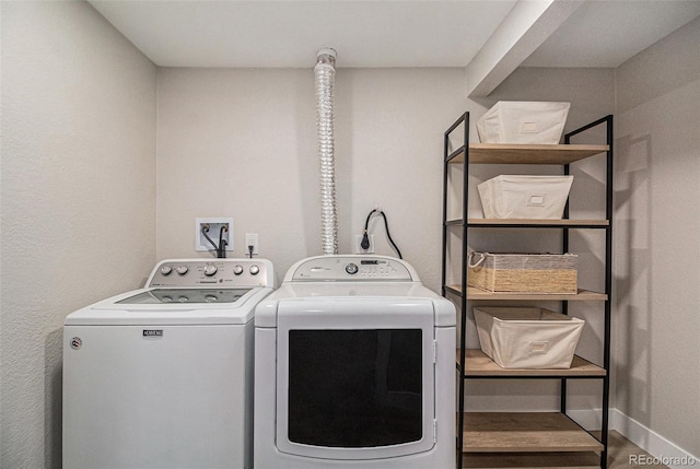 clothes washing area with independent washer and dryer