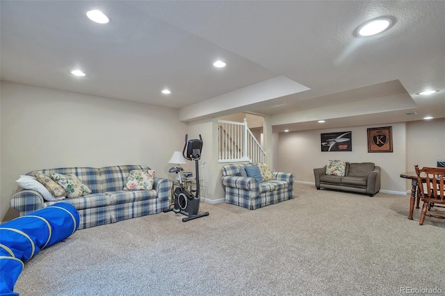 carpeted living room featuring stairway, recessed lighting, and baseboards