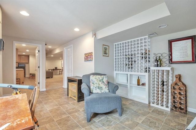 sitting room featuring recessed lighting and baseboards