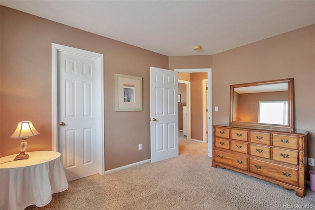 bedroom featuring baseboards and carpet floors