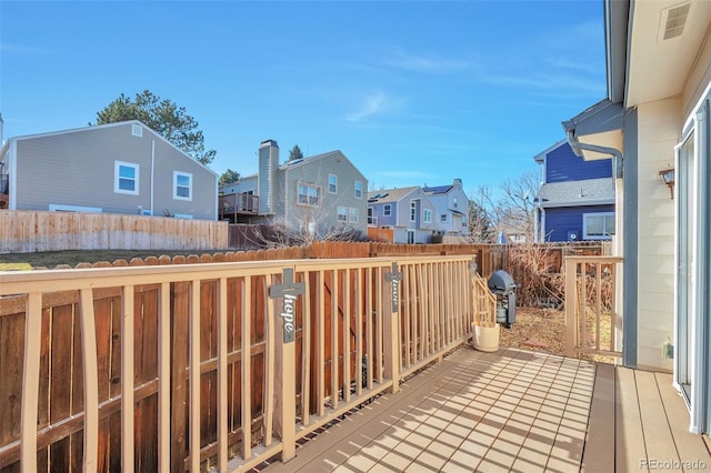 view of wooden balcony with grilling area, a residential view, and a deck