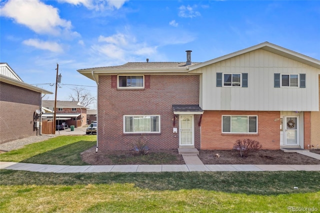 9044 E Nassau Ave, Denver, CO 80237 - view of front of home featuring a front lawn and brick siding