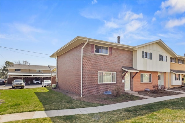 9044 E Nassau Ave, Denver, CO 80237 - multi unit property featuring brick siding and a front yard