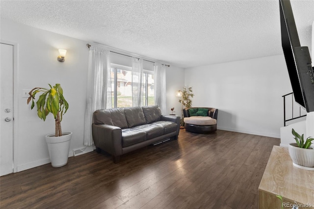 9044 E Nassau Ave, Denver, CO 80237 - living room with a textured ceiling and dark wood-style flooring