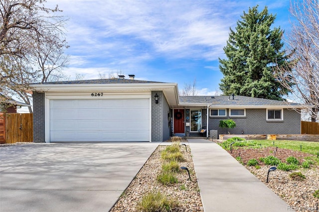 6267 S Josephine Way, Centennial, CO 80121 - single story home with brick siding, a garage, and driveway