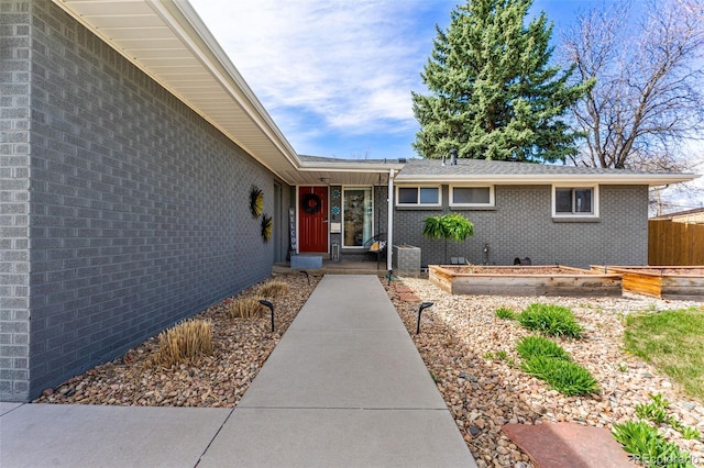 6267 S Josephine Way, Centennial, CO 80121 - doorway to property featuring brick siding