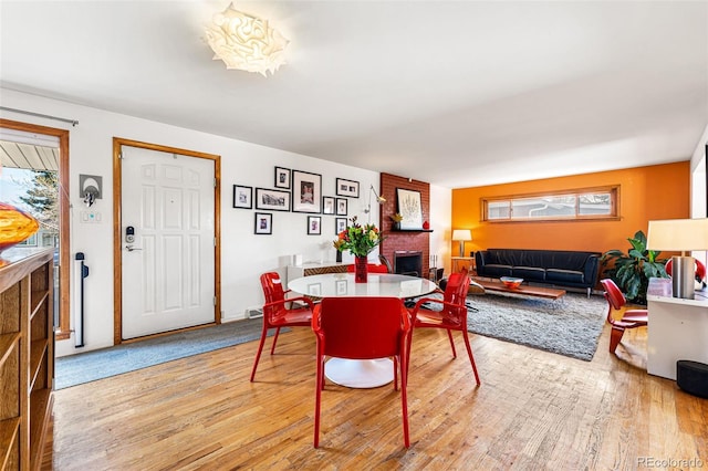 6267 S Josephine Way, Centennial, CO 80121 - dining room featuring light wood finished floors and a brick fireplace