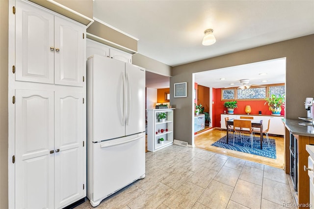 6267 S Josephine Way, Centennial, CO 80121 - kitchen with freestanding refrigerator, white cabinets, and ceiling fan