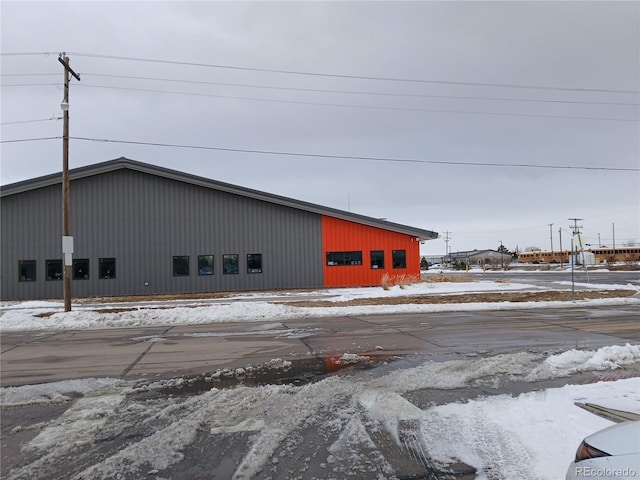490 Washington Ave Unit A, Bennett, CO 80102 - snow covered property featuring an outbuilding