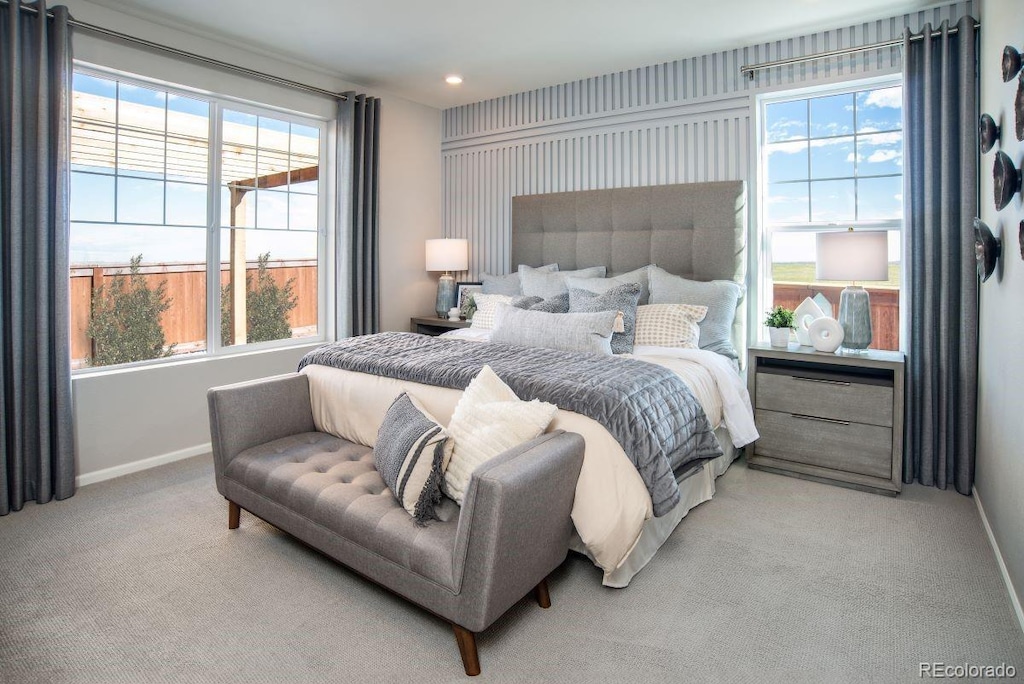 bedroom with light colored carpet