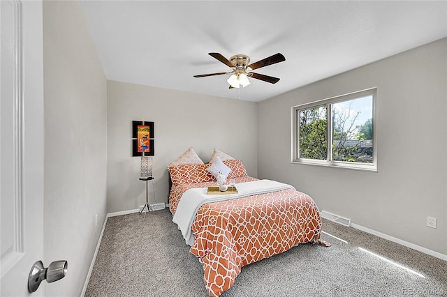 carpeted bedroom with baseboards and a ceiling fan