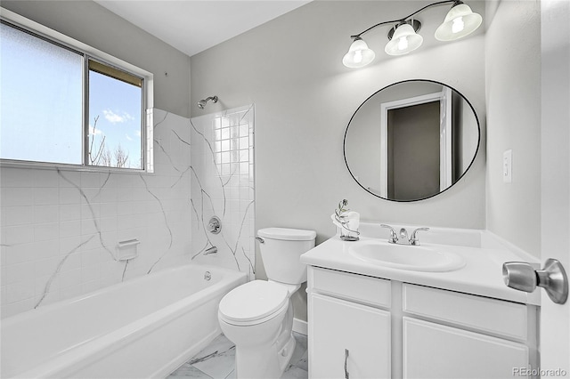 bathroom featuring toilet, marble look tiles, vanity, and bathing tub / shower combination
