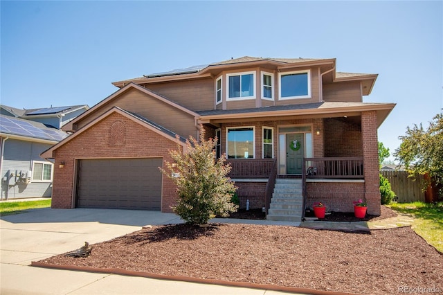 view of front of house featuring a garage and a porch