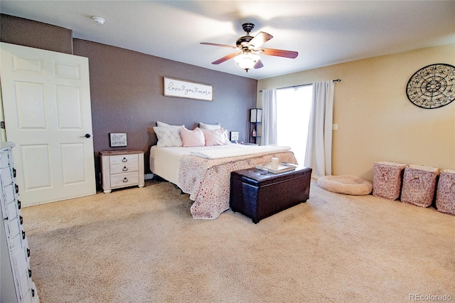 bedroom featuring light carpet and ceiling fan