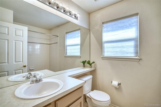 4142 S Deframe Ct, Morrison, CO 80465 - full bathroom featuring vanity, a shower, and toilet