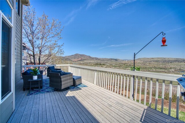4142 S Deframe Ct, Morrison, CO 80465 - wooden deck featuring a mountain view