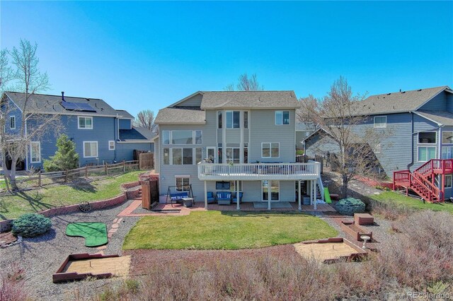 4142 S Deframe Ct, Morrison, CO 80465 - back of property with a patio, a fenced backyard, stairway, and a deck