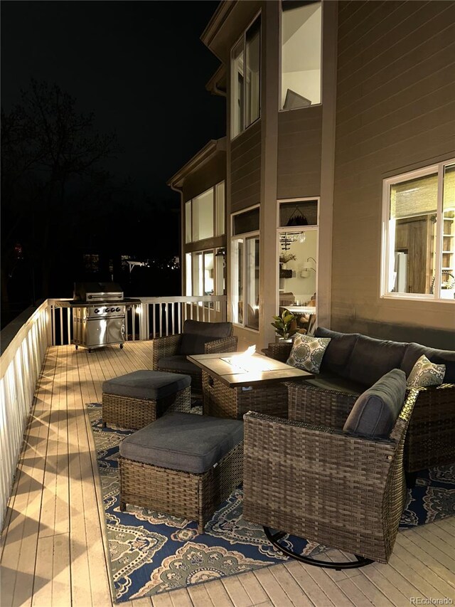 4142 S Deframe Ct, Morrison, CO 80465 - deck at twilight featuring an outdoor living space and a grill