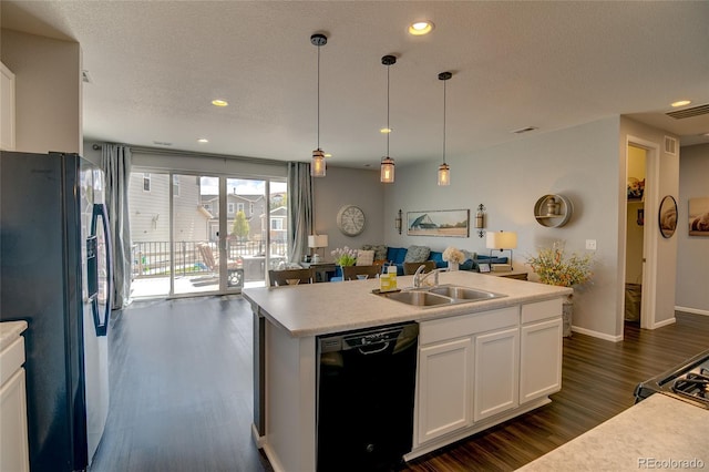 kitchen with dishwasher, stainless steel refrigerator with ice dispenser, a sink, dark wood-style floors, and white cabinets