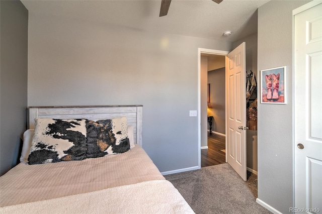 bedroom with carpet, baseboards, and ceiling fan