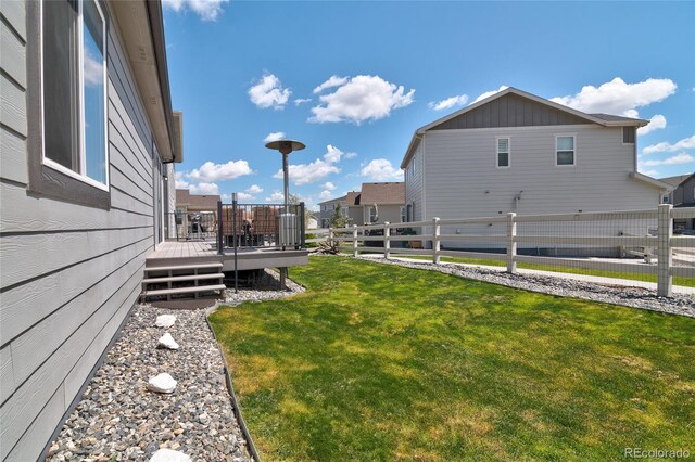 view of yard with a wooden deck