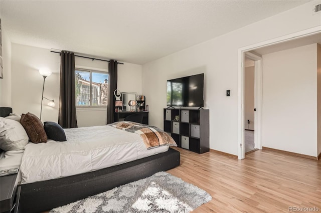 8225 Fairmount Dr Unit 104, Denver, CO 80247 - bedroom featuring light wood finished floors and baseboards