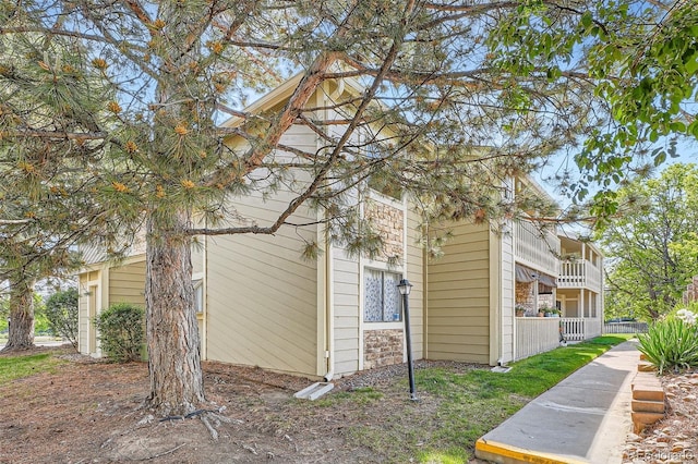 8225 Fairmount Dr Unit 104, Denver, CO 80247 - view of side of property featuring a balcony