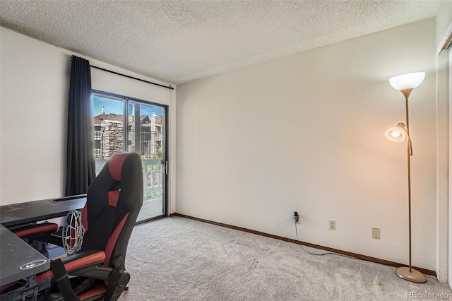 8225 Fairmount Dr Unit 104, Denver, CO 80247 - home office featuring carpet flooring, a textured ceiling, and baseboards