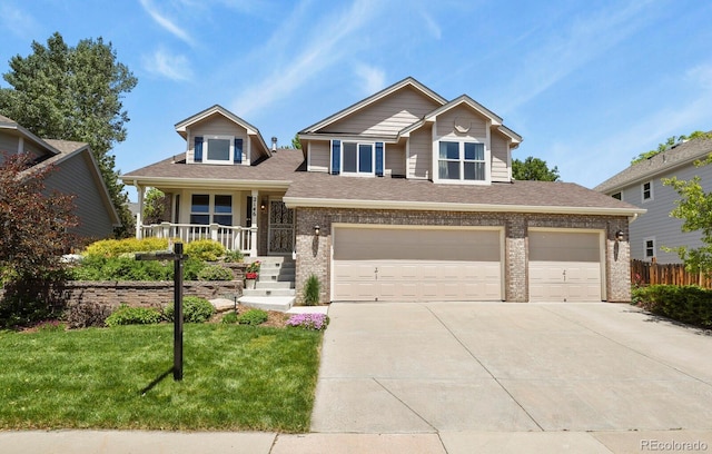 2146 S Ellis Ct, Lakewood, CO 80228 - view of front of home with brick siding, driveway, an attached garage, a porch, and a shingled roof