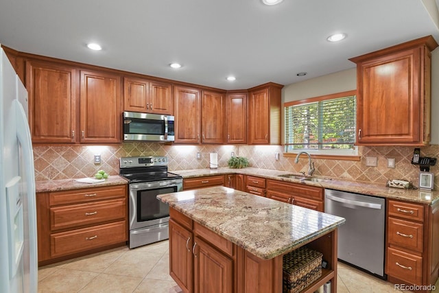 2146 S Ellis Ct, Lakewood, CO 80228 - kitchen featuring appliances with stainless steel finishes, a sink, brown cabinetry, open shelves, and recessed lighting
