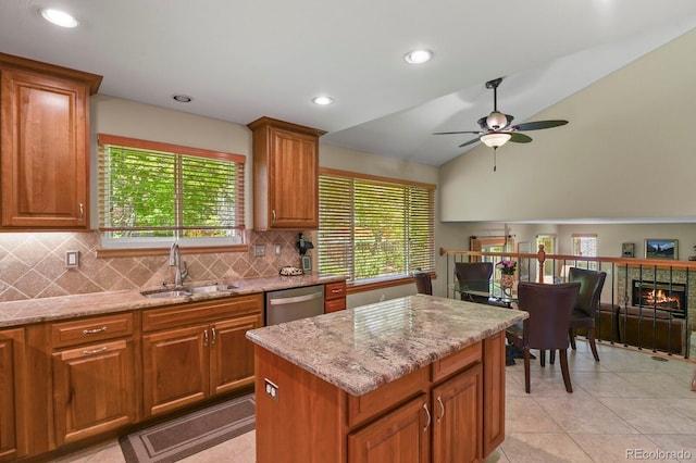 2146 S Ellis Ct, Lakewood, CO 80228 - kitchen featuring a sink, dishwasher, ceiling fan, tasteful backsplash, and lofted ceiling