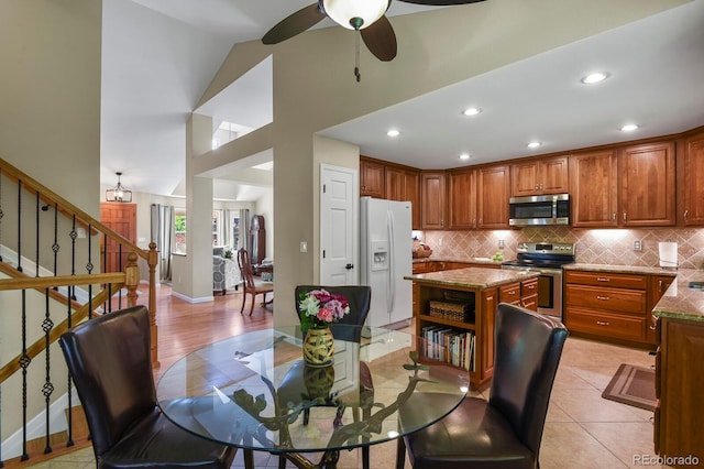 2146 S Ellis Ct, Lakewood, CO 80228 - dining area featuring a ceiling fan, stairs, light tile patterned floors, baseboards, and recessed lighting