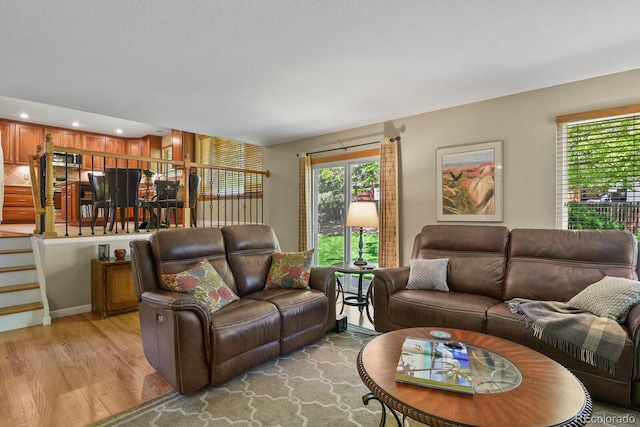 2146 S Ellis Ct, Lakewood, CO 80228 - living room featuring plenty of natural light and light wood-style floors