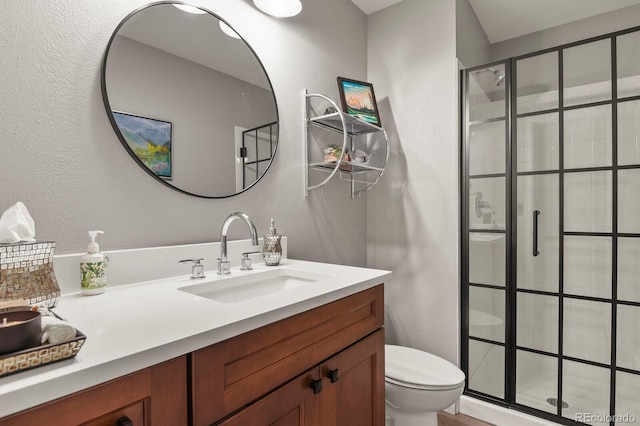 2146 S Ellis Ct, Lakewood, CO 80228 - full bathroom with toilet, a stall shower, and vanity