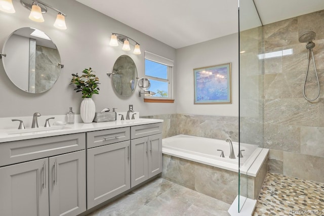 2146 S Ellis Ct, Lakewood, CO 80228 - bathroom with a garden tub, tiled shower, and double vanity