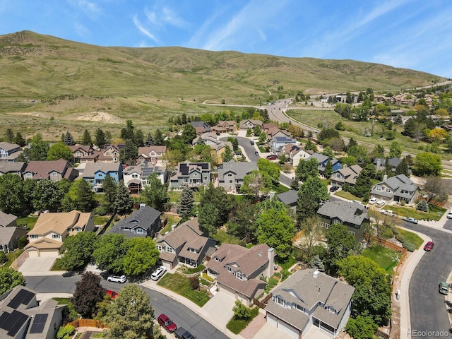 2146 S Ellis Ct, Lakewood, CO 80228 - aerial overview of property's location featuring nearby suburban area and a mountainous background