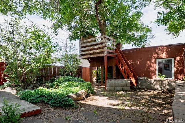 131 Fox St, Denver, CO 80223 - view of yard with stairway and a deck