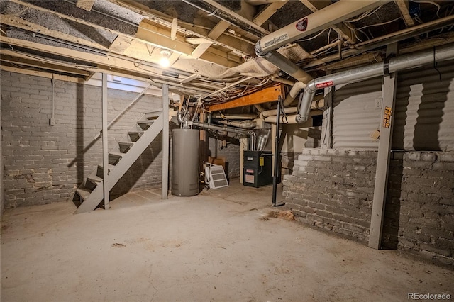 131 Fox St, Denver, CO 80223 - unfinished basement with water heater and stairway