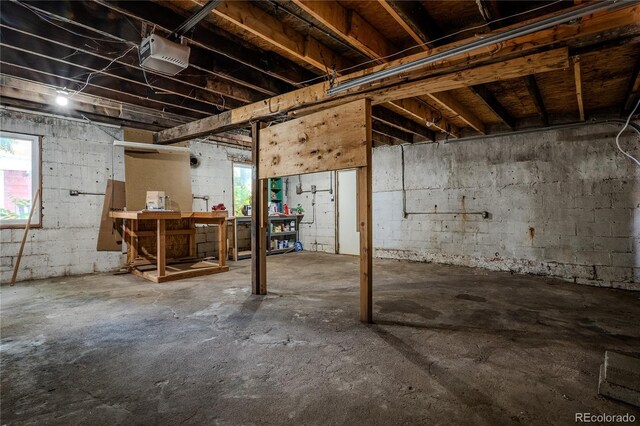 131 Fox St, Denver, CO 80223 - below grade area featuring a workshop area