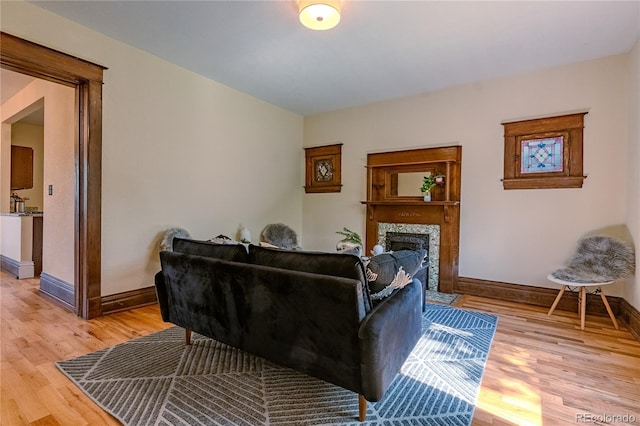 131 Fox St, Denver, CO 80223 - living room with a fireplace and light wood finished floors