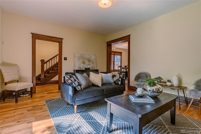 131 Fox St, Denver, CO 80223 - living room featuring stairway and light wood-style flooring