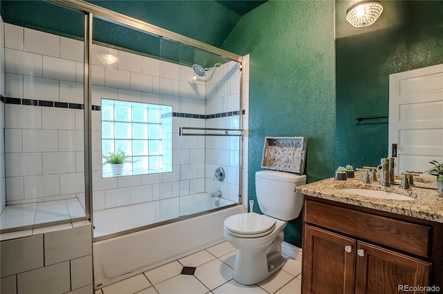 131 Fox St, Denver, CO 80223 - full bath featuring a textured wall, vanity, combined bath / shower with glass door, and tile patterned flooring