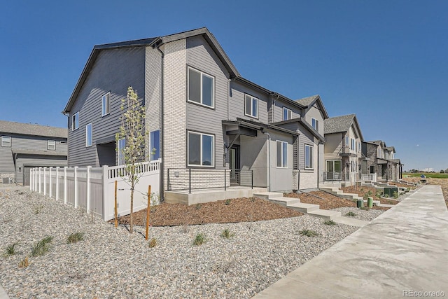 1290 S Algonquian St, Aurora, CO 80018 - view of front of house featuring a residential view and fence